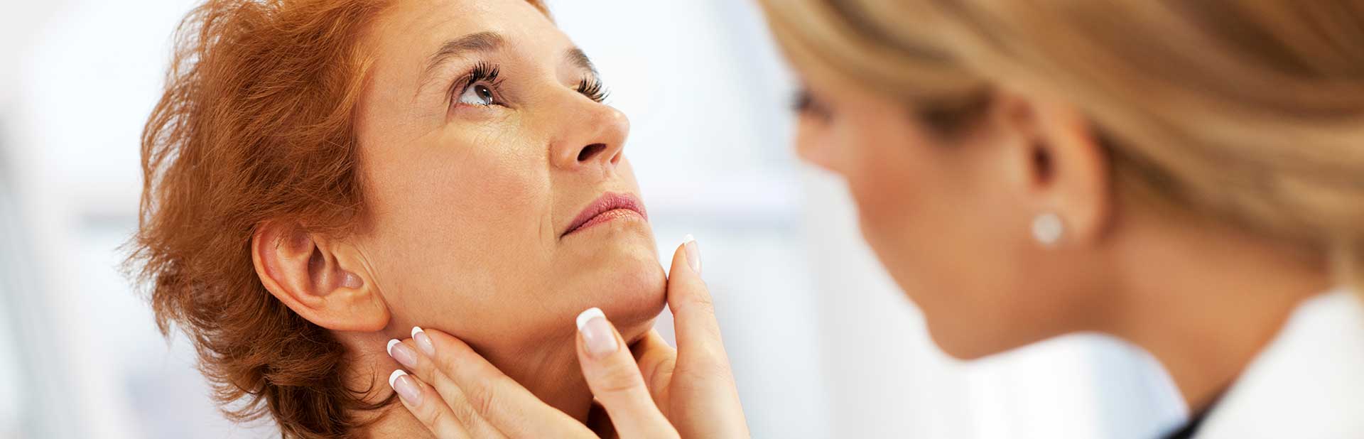 Physician Performing a Neck Exam